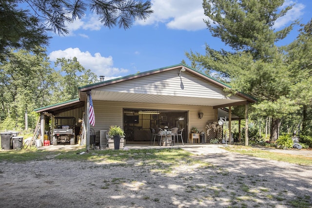 view of front of home featuring a garage and a carport