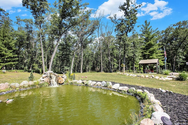 property view of water with a gazebo