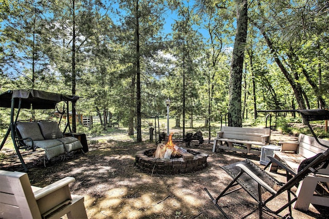 view of patio with an outdoor fire pit