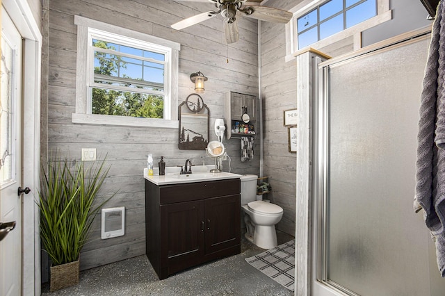 bathroom featuring vanity, an enclosed shower, and wooden walls