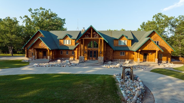 log home with a front lawn