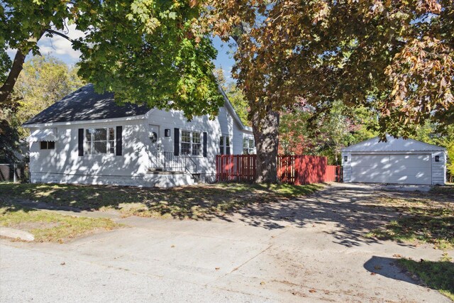 view of front facade with a garage and an outdoor structure