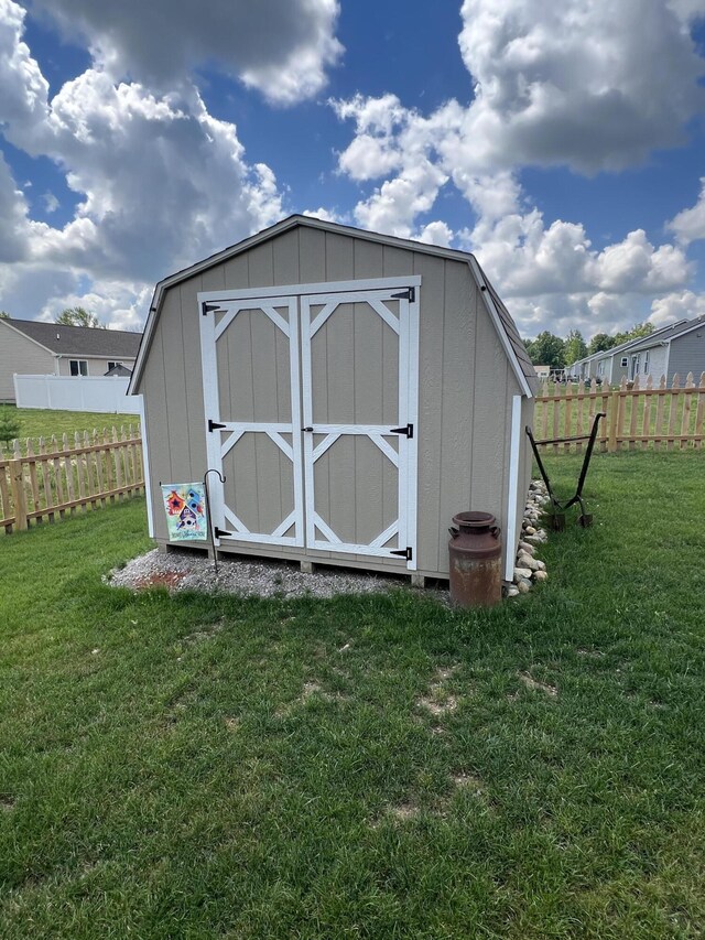 view of outdoor structure with a lawn