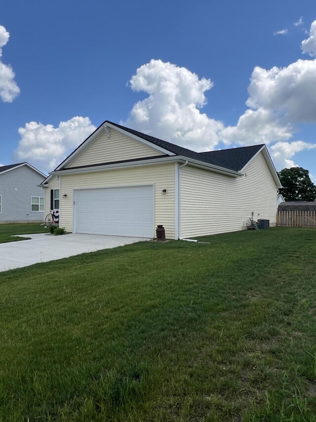 view of home's exterior with a yard and a garage