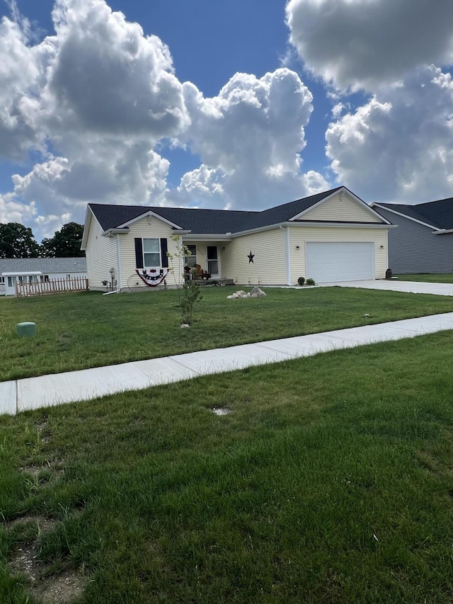 view of front of home featuring a garage and a front yard