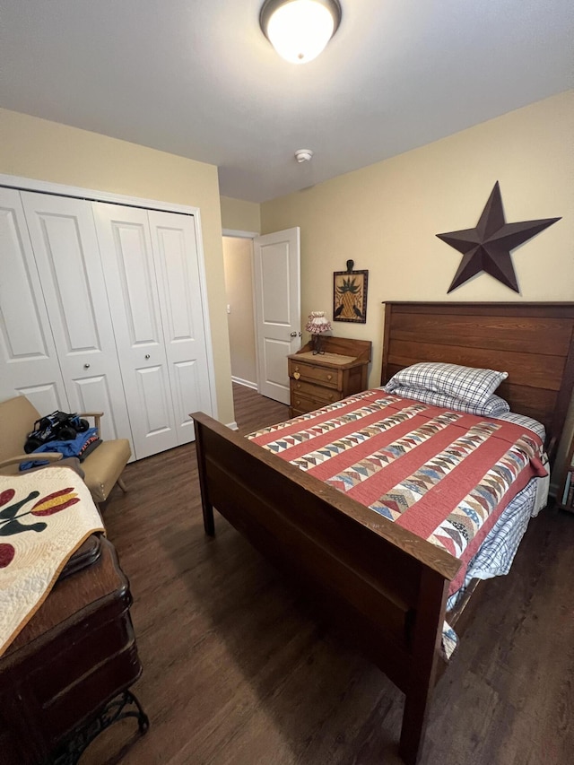 bedroom featuring dark hardwood / wood-style floors and a closet