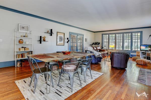 dining space with hardwood / wood-style floors and ornamental molding