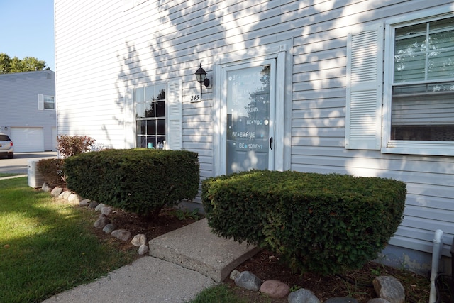 view of exterior entry featuring central AC