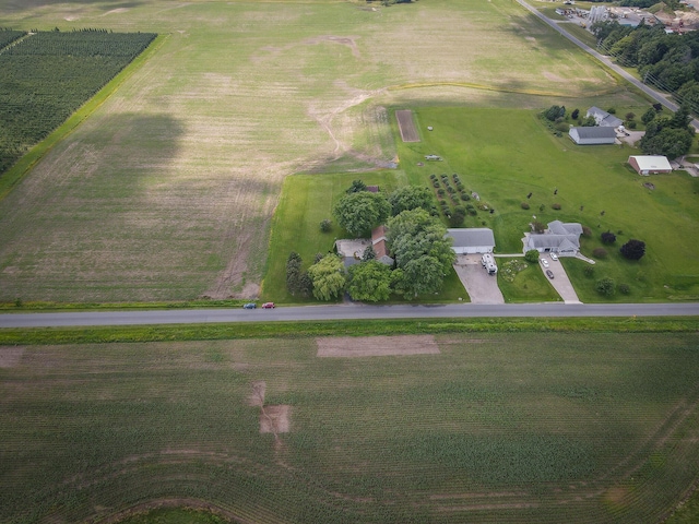 birds eye view of property with a rural view and a water view