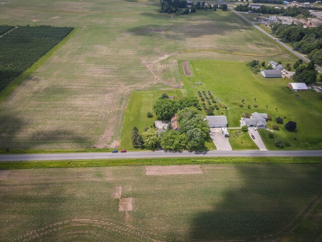 aerial view featuring a rural view and a water view