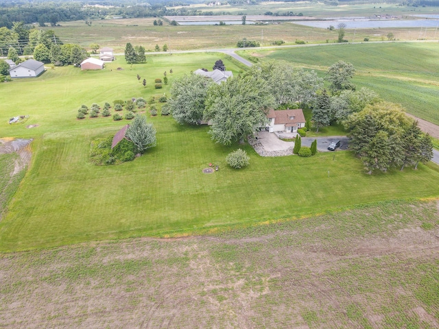 birds eye view of property with a water view and a rural view