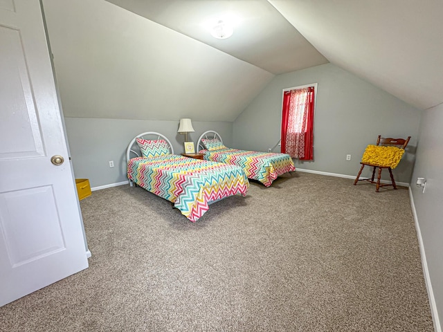 bedroom featuring carpet and vaulted ceiling