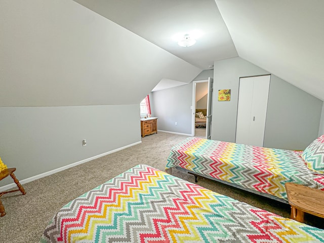 unfurnished bedroom with carpet floors and lofted ceiling