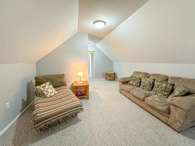 carpeted living room featuring vaulted ceiling