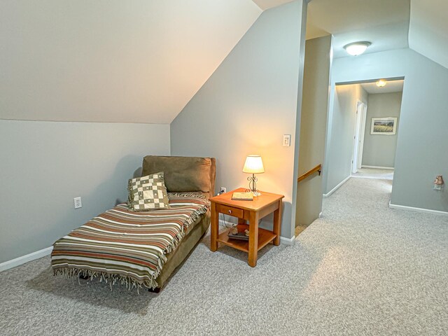 living area with carpet flooring and lofted ceiling