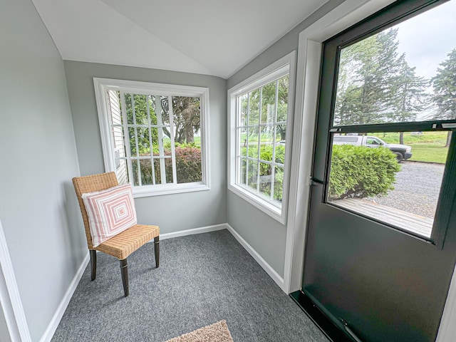 sunroom featuring lofted ceiling