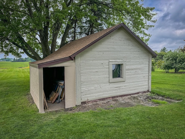 view of outdoor structure featuring a lawn