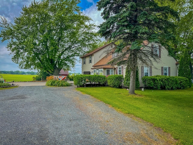 view of side of home featuring a lawn