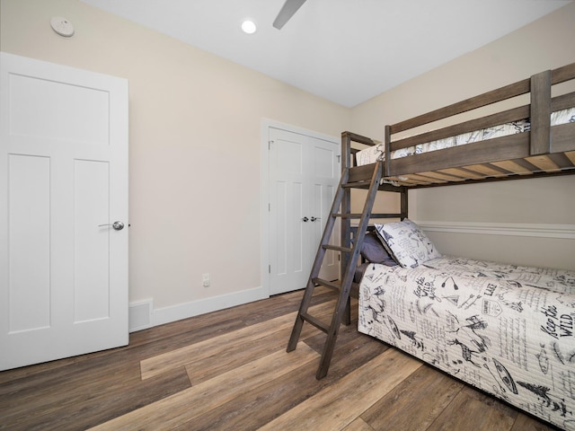 bedroom with ceiling fan and hardwood / wood-style floors