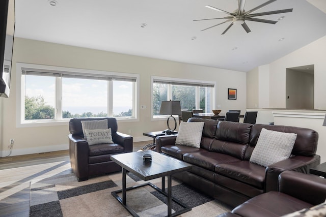 living room with lofted ceiling and light hardwood / wood-style flooring