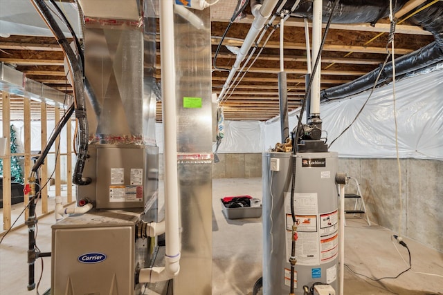 utility room featuring heating unit and gas water heater