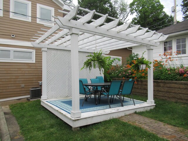 wooden deck featuring cooling unit and a pergola