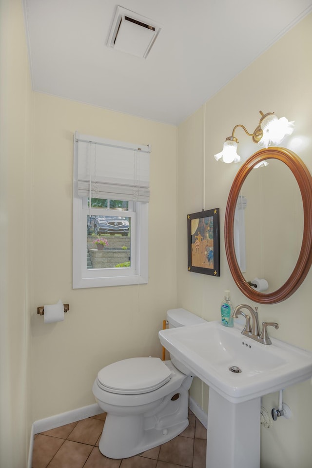 bathroom featuring sink, tile patterned floors, and toilet