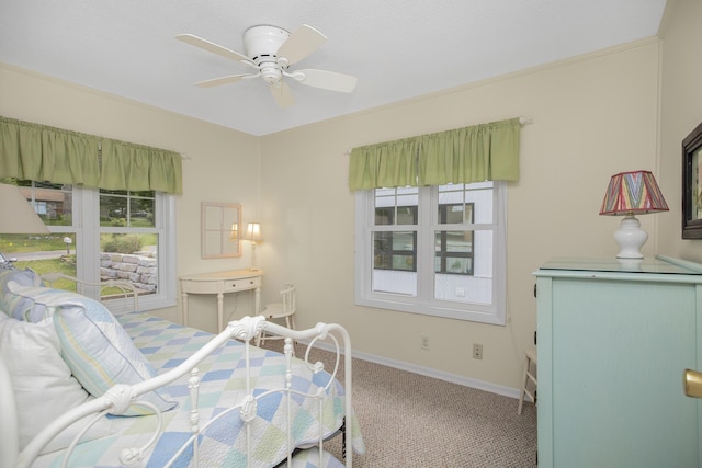 bedroom with ceiling fan and carpet