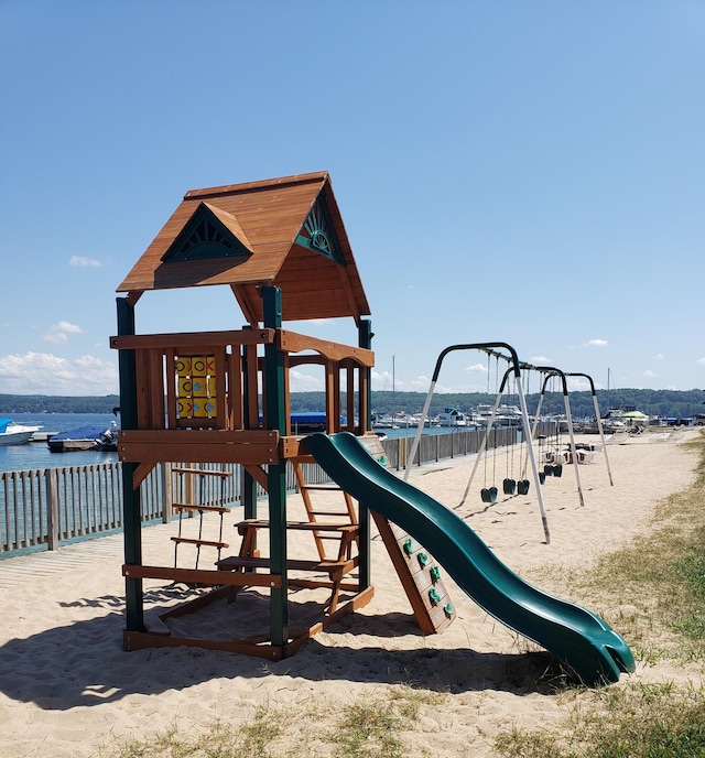 view of playground with a water view