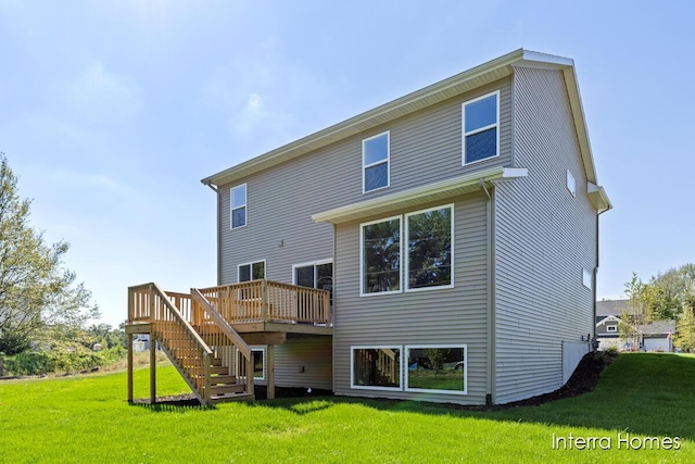 back of property featuring a lawn, stairs, and a deck