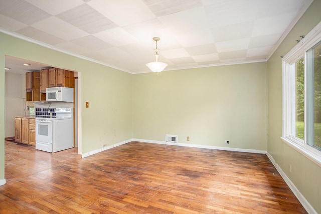 interior space featuring ornamental molding and hardwood / wood-style floors