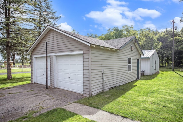 garage with a yard