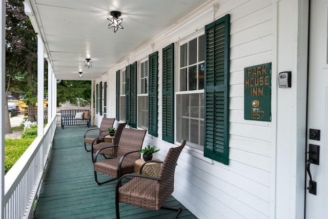 wooden deck featuring a porch