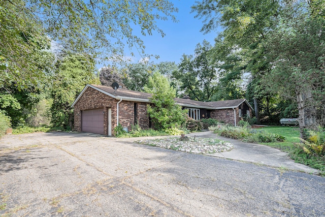 single story home featuring a garage