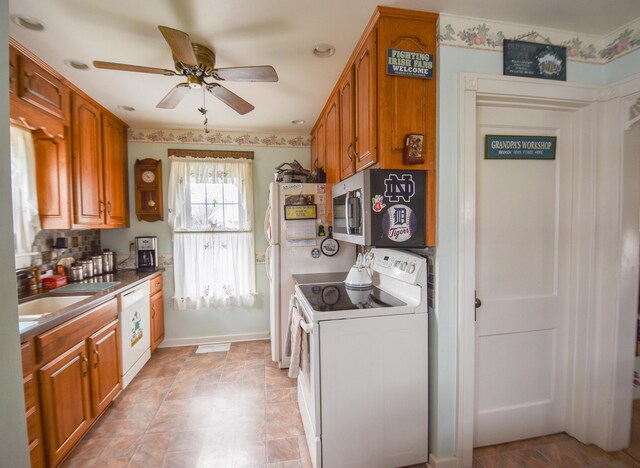 kitchen with ceiling fan, white appliances, and sink