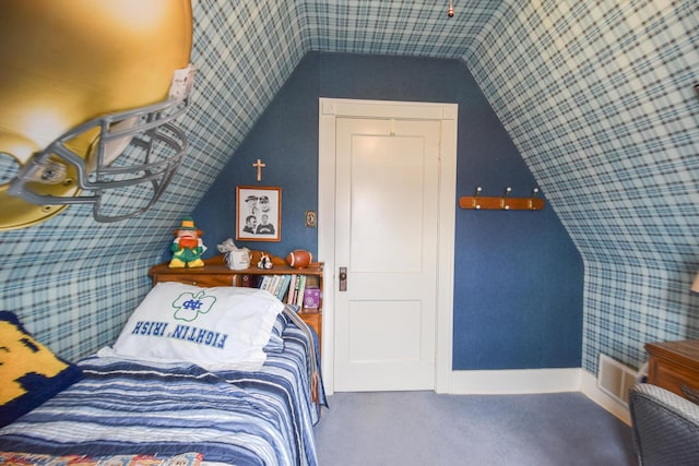 bedroom with carpet flooring and lofted ceiling