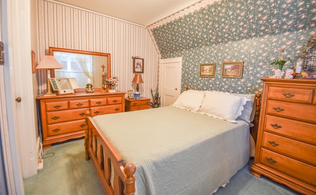 carpeted bedroom featuring vaulted ceiling