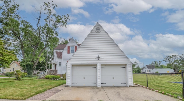 garage with a yard