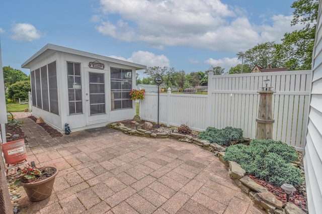 view of patio featuring a sunroom