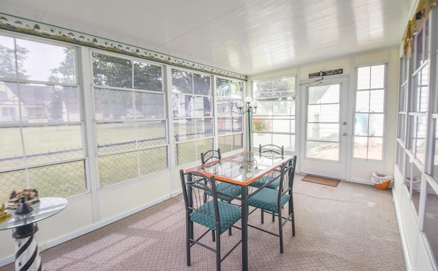 sunroom / solarium featuring plenty of natural light