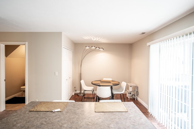 dining area featuring dark hardwood / wood-style floors