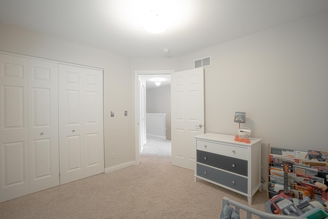 carpeted bedroom with a closet