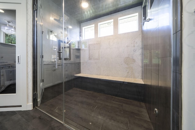 bathroom with plenty of natural light and walk in shower