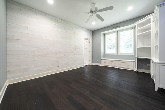 spare room with ceiling fan and dark hardwood / wood-style floors