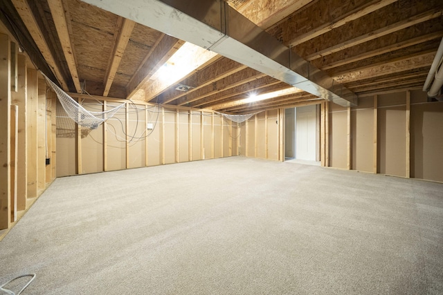 basement featuring carpet flooring