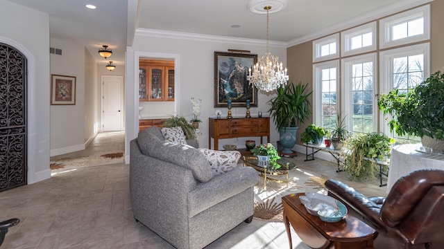 living room with ornamental molding and a chandelier