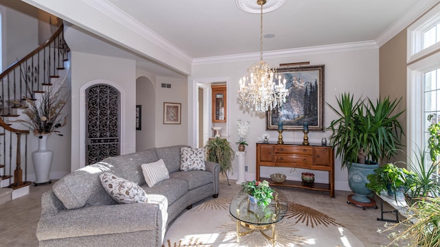 living room featuring an inviting chandelier and ornamental molding