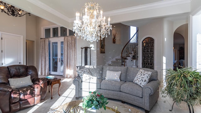 living room with crown molding and a chandelier