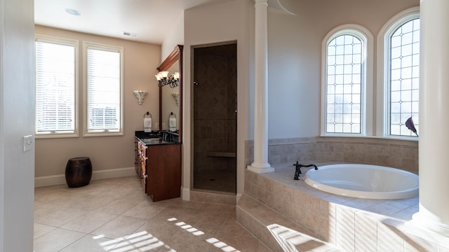 bathroom with decorative columns, vanity, independent shower and bath, and tile patterned flooring