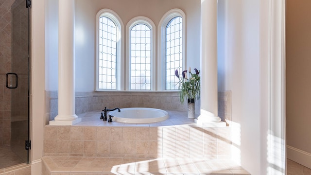 bathroom with plus walk in shower and ornate columns